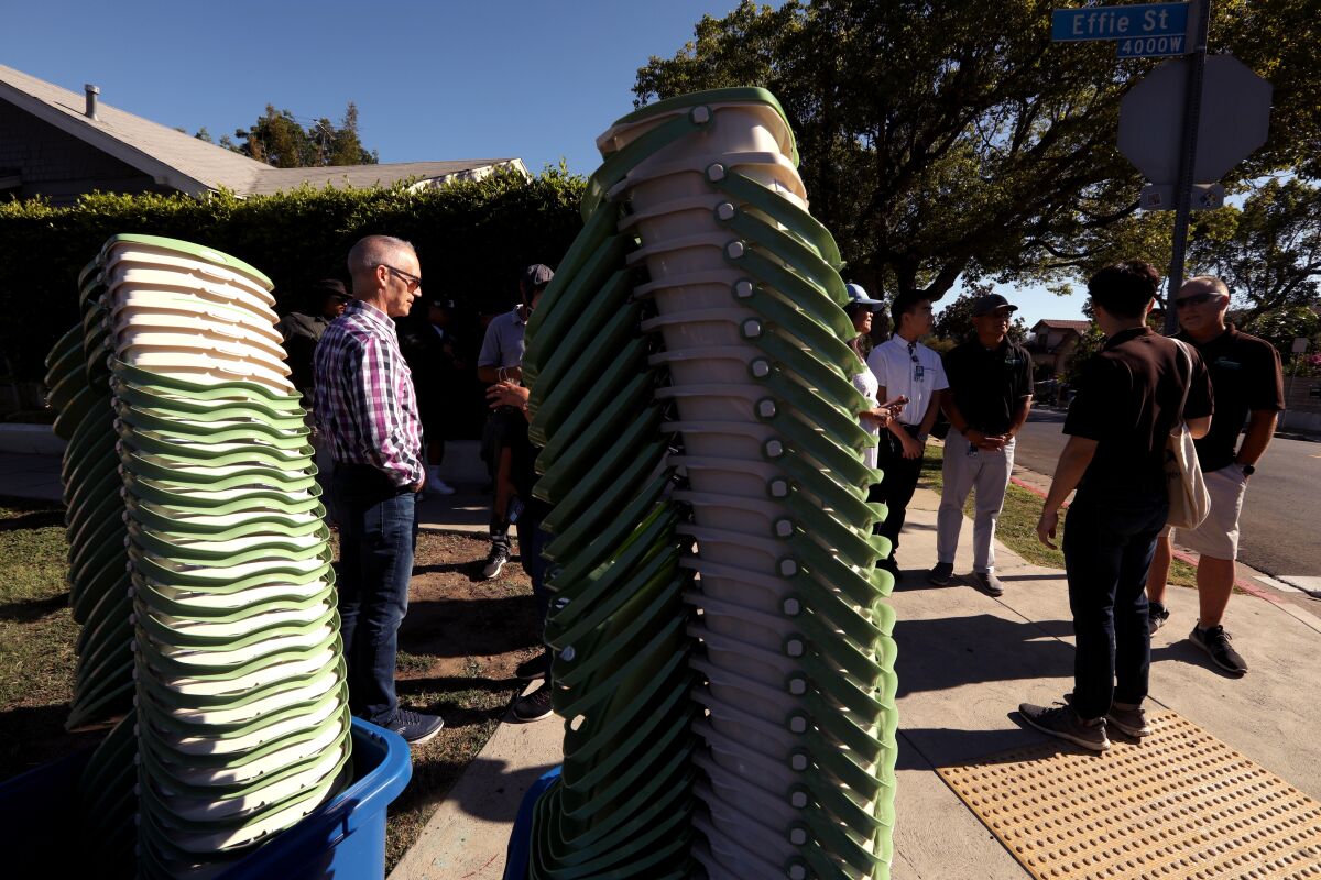 L.A. sanitation workers prepare to deliver in-home composting pails door to door in Los Feliz on Aug. 6.