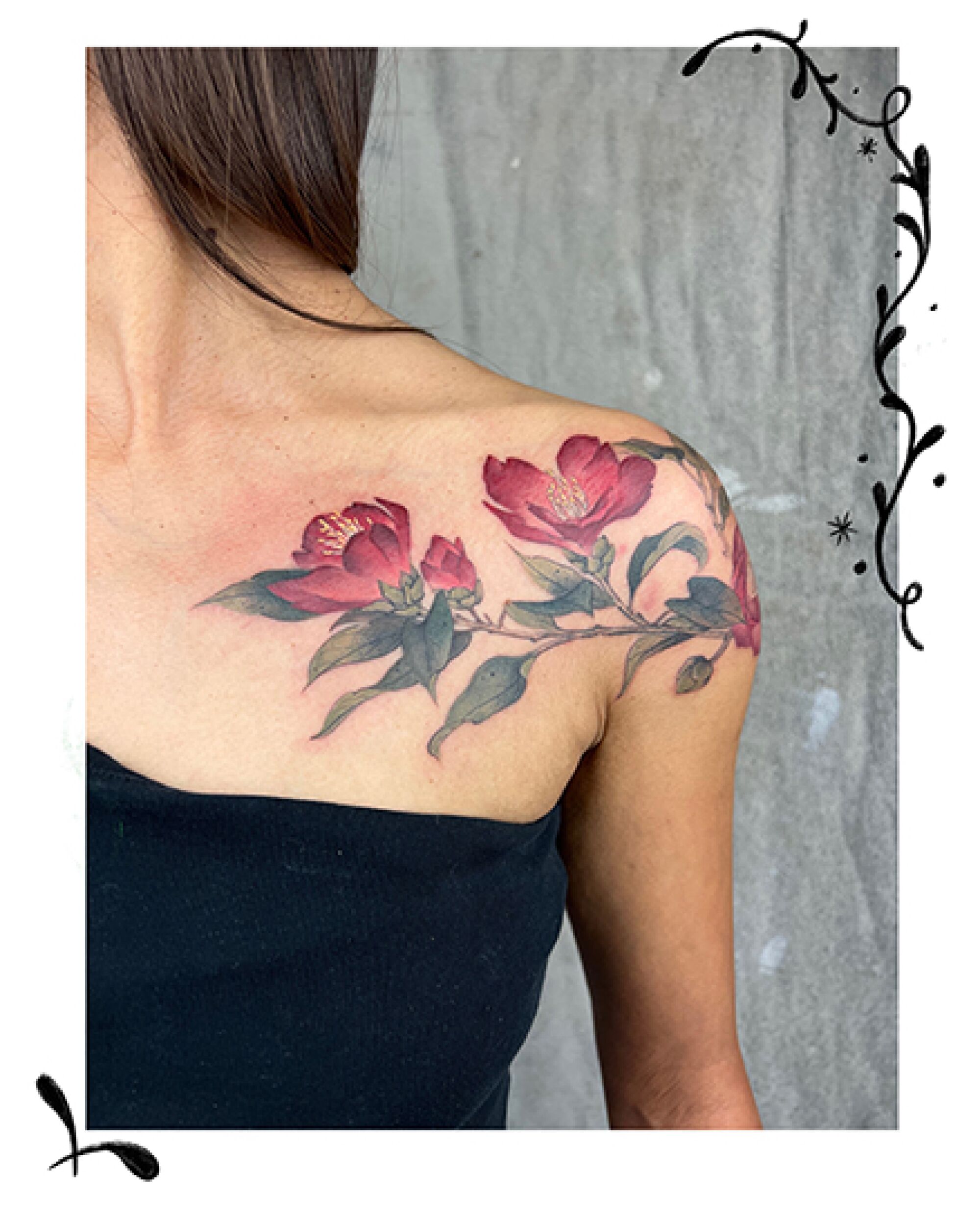 A Japanese camellia tattoo above the breast. 