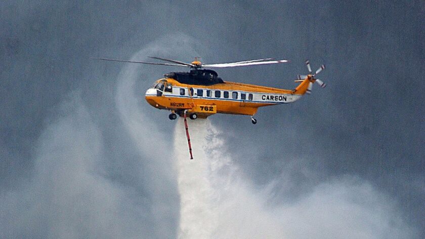 San Diego May Spend 34m On Firefighting Chopper Storage Hangar - a s 61 sikorsky sea king helicopter drops water on a section of