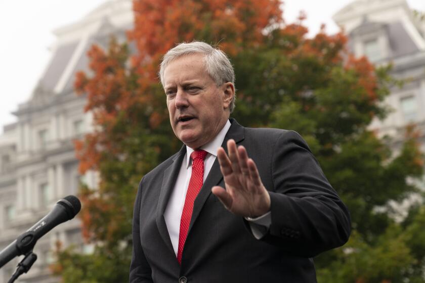 White House chief of staff Mark Meadows speaks with reporters at the White House, Wednesday, Oct. 21, 2020, in Washington. (AP Photo/Alex Brandon)