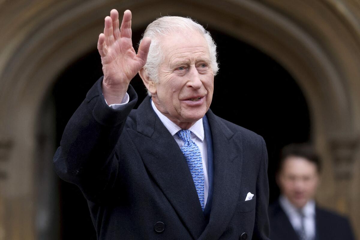 Britain's King Charles III waves as he leaves after attending the Easter Matins Service