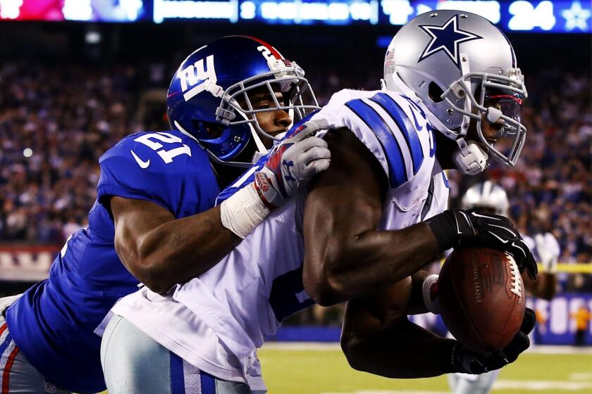 Cowboys wide receiver Dez Bryant brings down the game-winning touchdown catch against Giants cornerback Dominique Rodgers-Cromartie late in the fourth quarter Sunday.