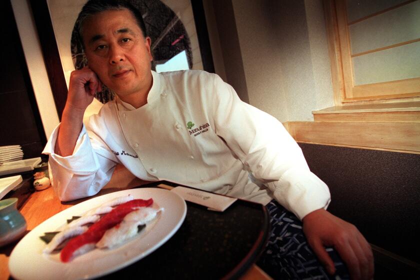 CA.NOBU.1.1210.LH––Chef and Restauranteur Nobu Matsuhisa in his restaurant(called Matsuhisa) by a plate of sushi he just made. photo taken 12–10–98Photo/Art by:Lawrence K. Ho