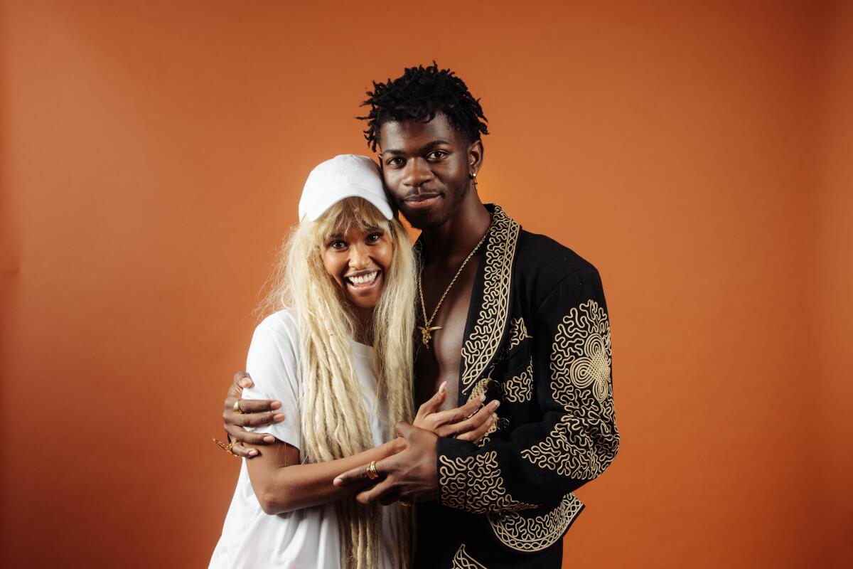 Rapper, singer and songwriter Lil Nas X, right, and stylist Hodo Musa. 
