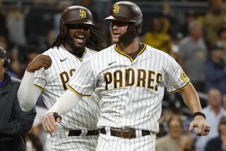SAN DIEGO, CA - OCTOBER 3: San Diego Padres' Wil Myers celebrates a three-run home run with Josh Bell in the eighth inning against the San Francisco Giants at Petco Park on Sunday, October 3, 2022 in San Diego, CA. (K.C. Alfred / The San Diego Union-Tribune)