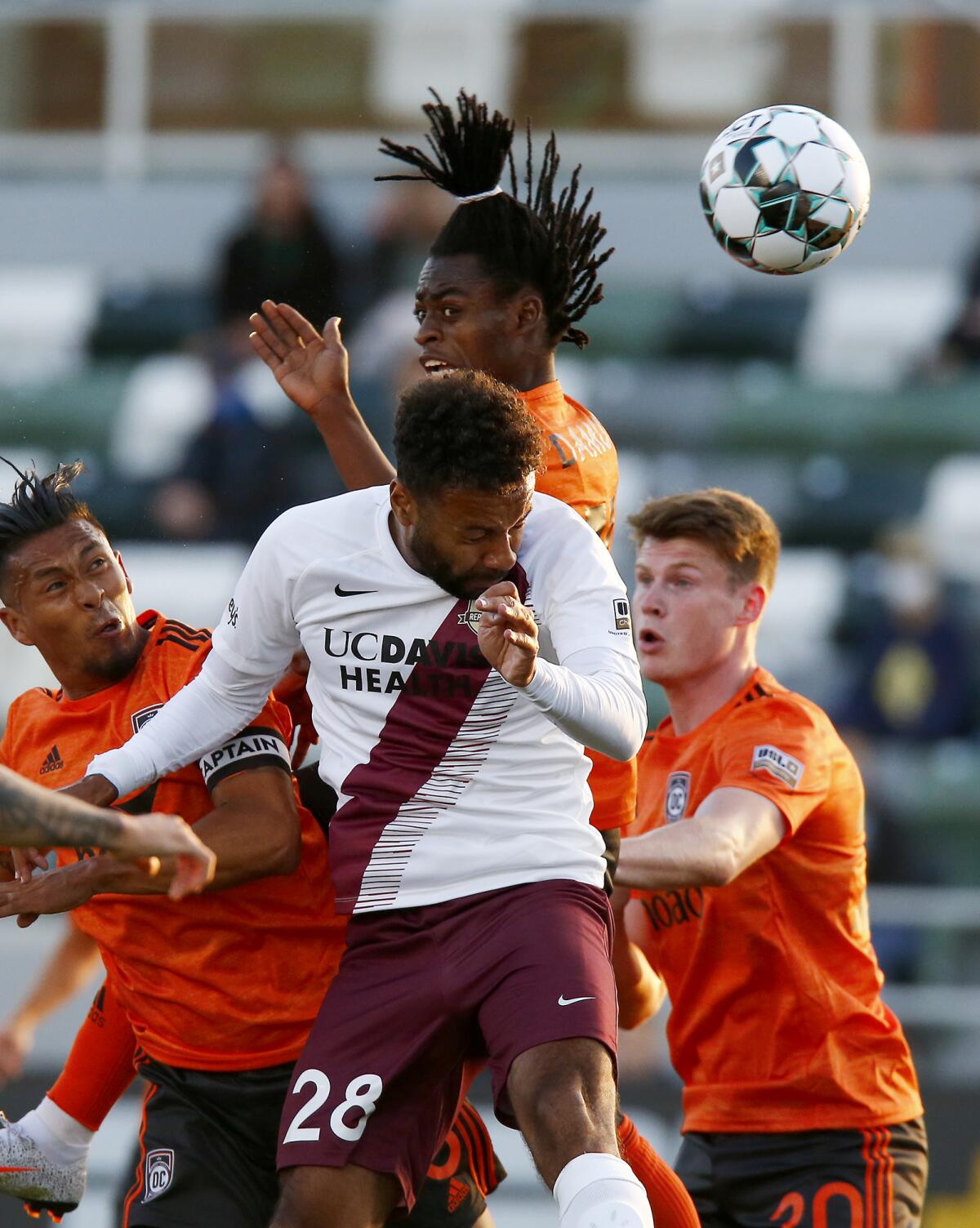 Orange County Soccer Club forward Ronaldo Damus, top center, attempts to score with a header against Sacramento Republic FC.