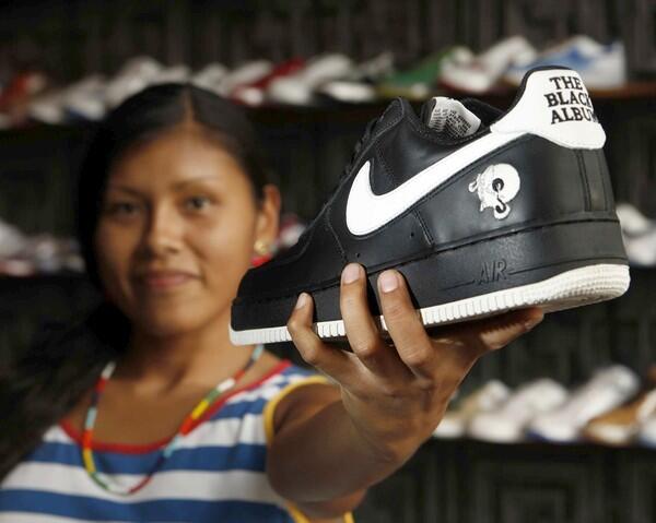 Liz Sanchez, manager of the Holy Grail in downtown Los Angeles, shows a Black Album Jay-Z shoe.