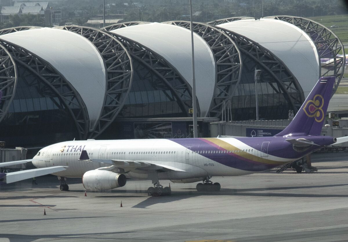 A Thai Airways jet sits on the tarmac at the Suvarnabhumi Airport in Bangkok, Thailand, Monday, Sept. 14, 2020. Thailand's Central Bankruptcy Court on Monday gave the go-ahead to financially ailing Thai Airways International to submit a business reorganization plan and appointed seven planners to oversee it. (AP Photo/Sakchai Lalit)