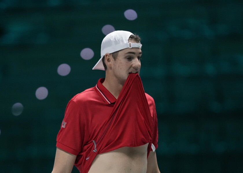 United States' John Isner reacts after missing a point chance against Colombia's Daniel Elahi Galan during their Davis Cup men's single Finals tennis match at the Pala Alpitour in Turin, Italy, Sunday, Nov. 28, 2021. (AP Photo/Antonio Calanni)