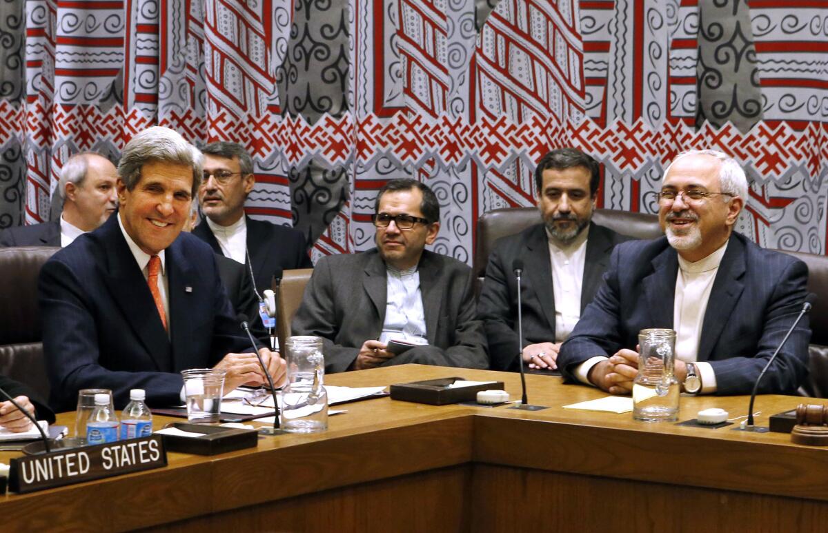 U.S. Secretary of State John Kerry, left, and Iranian Foreign Minister Mohammad Javad Zarif attend a meeting of the five permanent members of the Security Council plus Germany during the 68th session of the United Nations General Assembly at U.N. headquarters on Thursday.