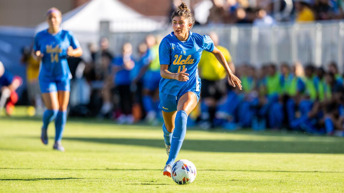 UCLA women’s soccer’s player Madelyn Desiano controls the ball during a match.