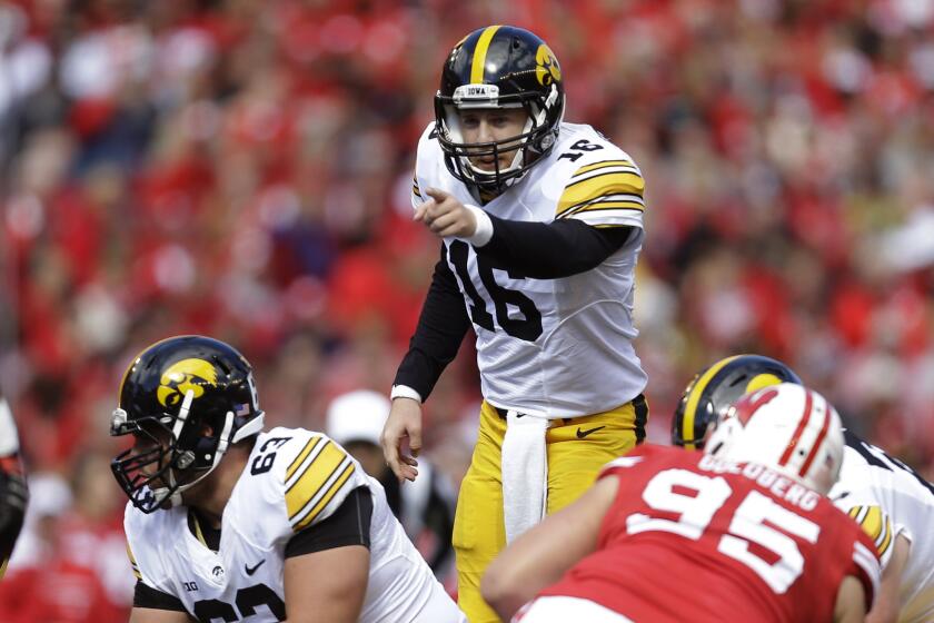 Iowa quarterback C.J. Beathard yell at the line of scrimmage during the first half of a game against Wisconsin on Oct. 3.