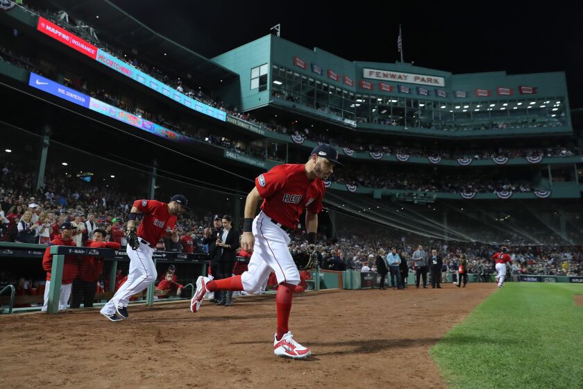 BOSTON, MA - OCTOBER 06: Ian Kinsler #5 of the Boston Red Sox (R) and his teammates take the field for Game Two of the American League Division Series against the New York Yankees at Fenway Park on October 6, 2018 in Boston, Massachusetts. (Photo by Elsa/Getty Images)