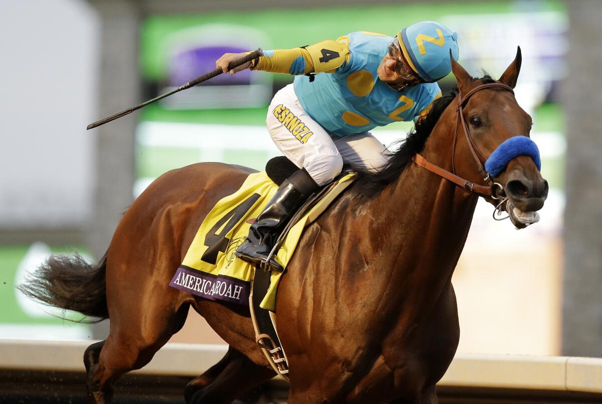 Jockey Victor Espinoza rides American Pharoah to victory in the 2015 Breeders' Cup Classic.