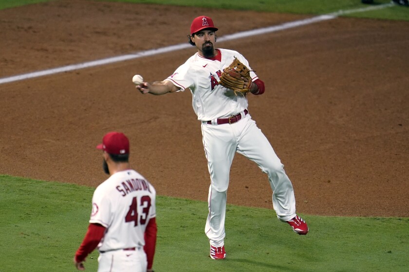 Los Angeles Angels third baseman Anthony Rendon makes an off-balance throw to put out Arizona Diamondbacks' Nick Ahmed at first base during the fifth inning of a baseball game Wednesday, Sept. 16, 2020, in Anaheim, Calif. (AP Photo/Marcio Jose Sanchez)