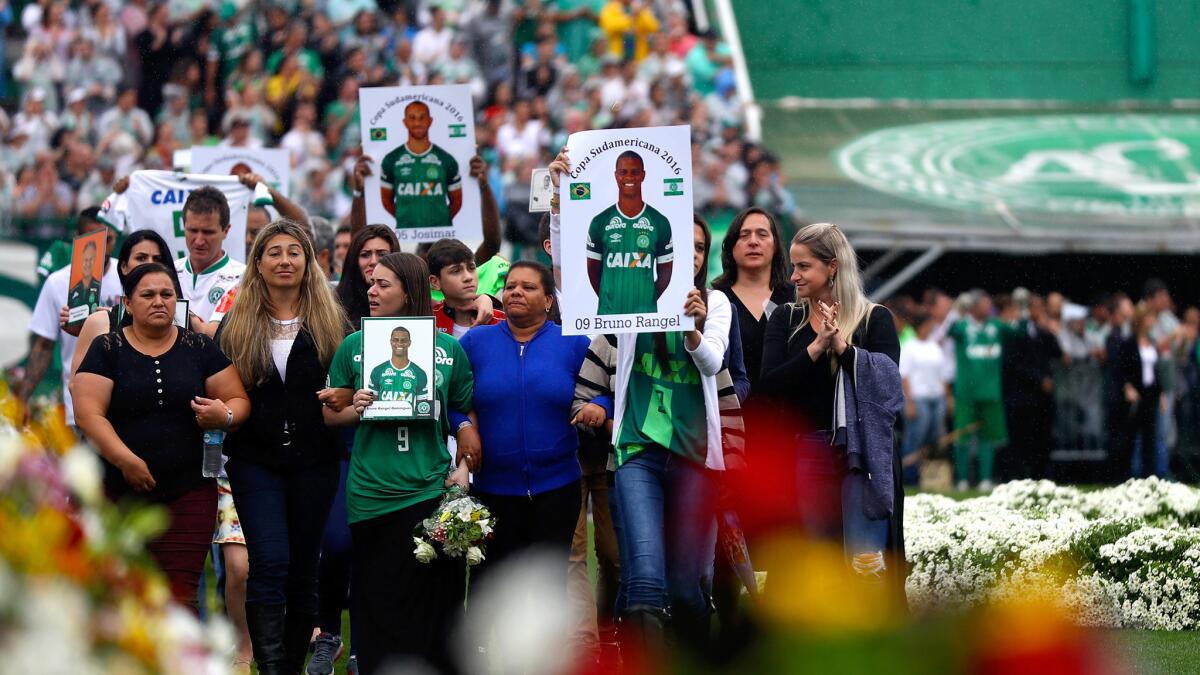 Relatives of the members of Chapecoense pay tribute at the club's Arena Conda Stadium in Chapeco on Saturday.