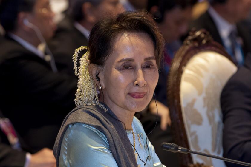 FILE - Myanmar leader Aung San Suu Kyi participates in the ASEAN-Japan summit in Nonthaburi, Thailand on Nov. 4, 2019. A legal official says ousted Myanmar leader Aung San Suu Kyi has been sentenced to 5 years in prison in the first of several corruption cases. (AP Photo/Gemunu Amarasinghe, File)