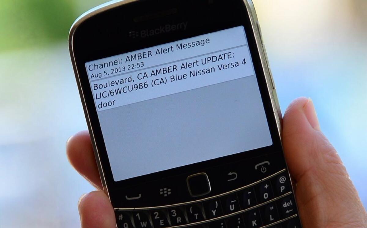 A cellphone displays the Amber Alert issued late Tuesday in Los Angeles, which marked the first time officials have notified the public of a statewide Amber Alert through their cellphones.