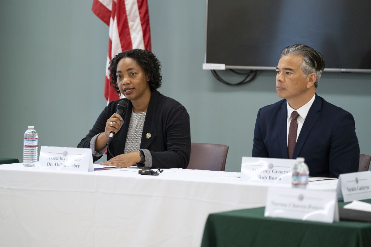 Assemblymember Akilah Weber, left, speaks at a roundtable with Attorney General Rob Bonta to discuss reproductive rights.
