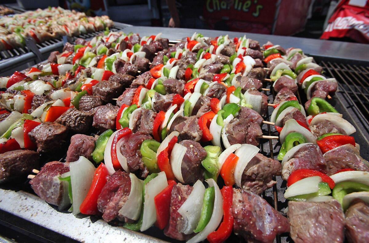 Kabobs rest on the grill at Chicken Charlies during opening day of the 2016 Orange County Fair.