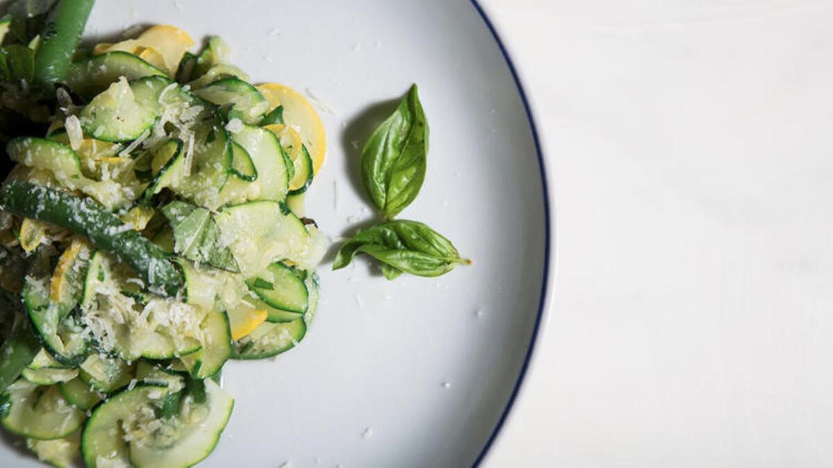 Summer squash pasta with greens and fresh herbs.