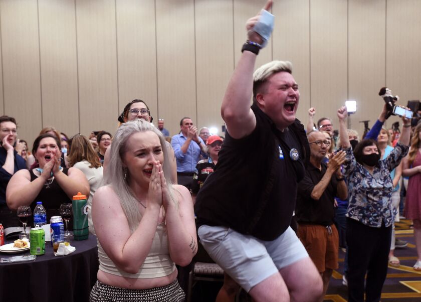 Abortion supporters react to the vote defeating the constitutional amendment
