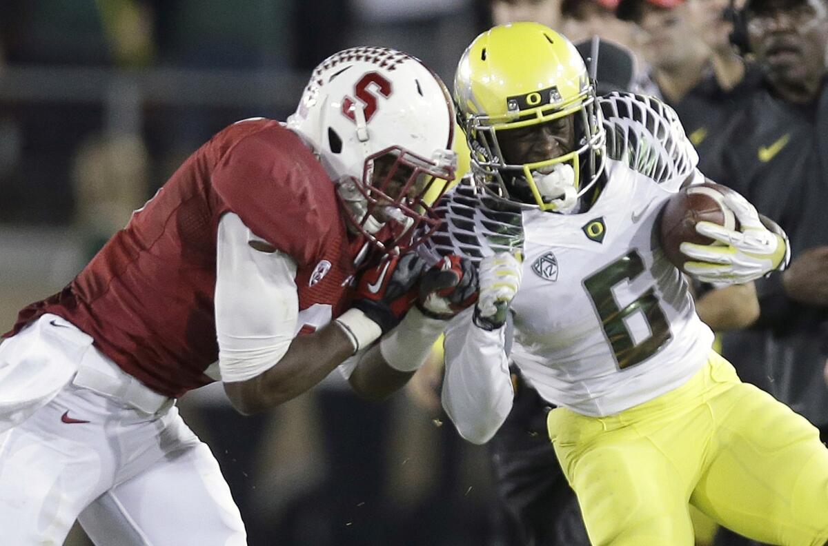 Stanford safety Jordan Richards, left, pushes Oregon running back De'Anthony Thomas out of bounds during the Cardinal's win Thursday. Will Stanford and Oregon be the latest -- and final -- Pac-12 victims of the wacky BCS format?