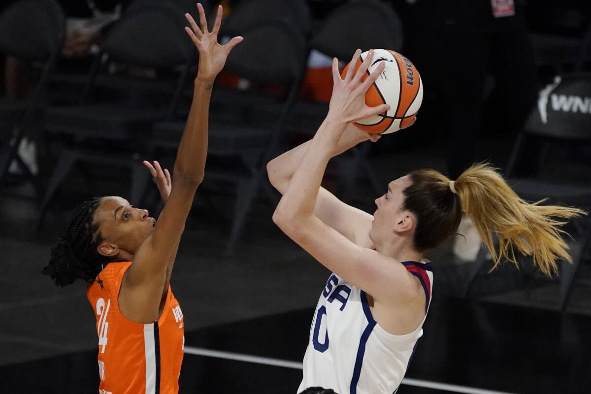 United States' Breanna Stewart shoots over Team WNBA's DeWanna Bonner during the first half of a WNBA All-Star basketball game, Wednesday, July 14, 2021, in Las Vegas. (AP Photo/John Locher)
