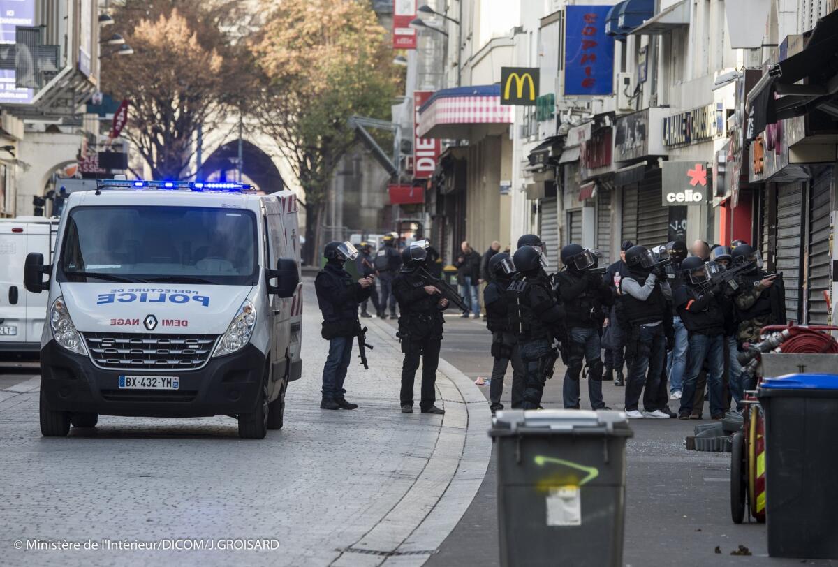 In this photo released Friday, Nov. 20, 2015, by the French Interior Ministry, police security forces are seen during the raid in the Saint-Denis region of Paris, France, on Wednesday, Nov. 18, 2015.