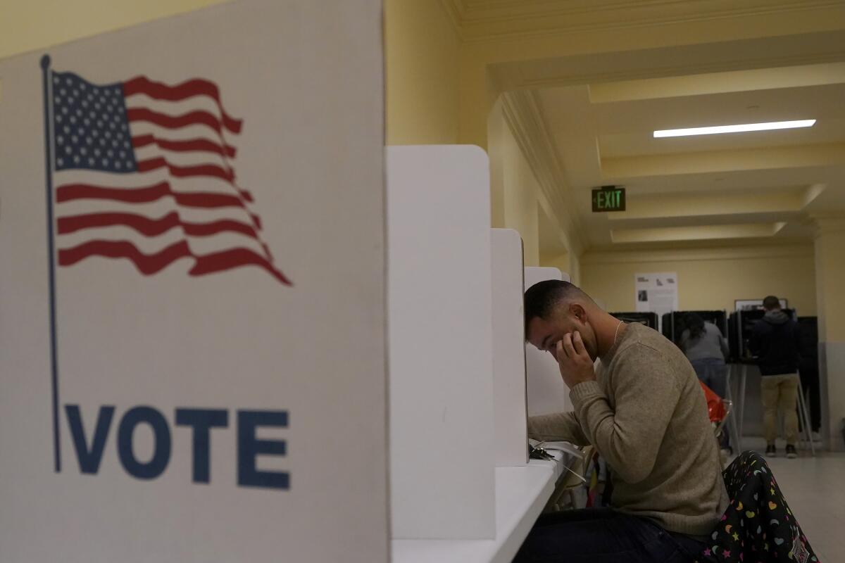 A man fills out his ballot 