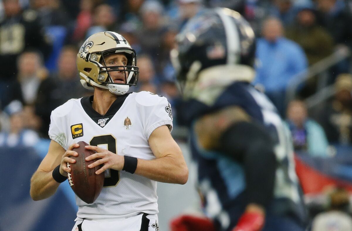 New Orleans Saints quarterback Drew Brees looks to pass against the Tennessee Titans on Sunday.