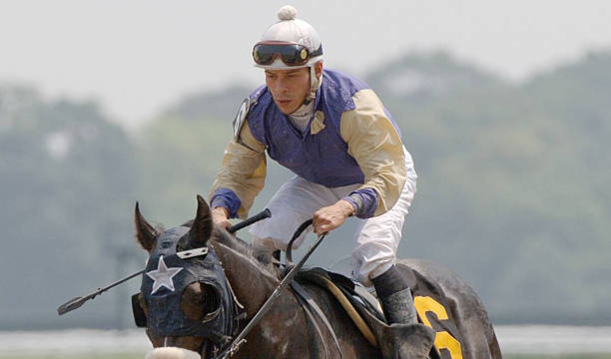 Jockey Norberto Arroyo Jr. rides Ace's Cappella in the first race at 2005 Belmont Stakes.
