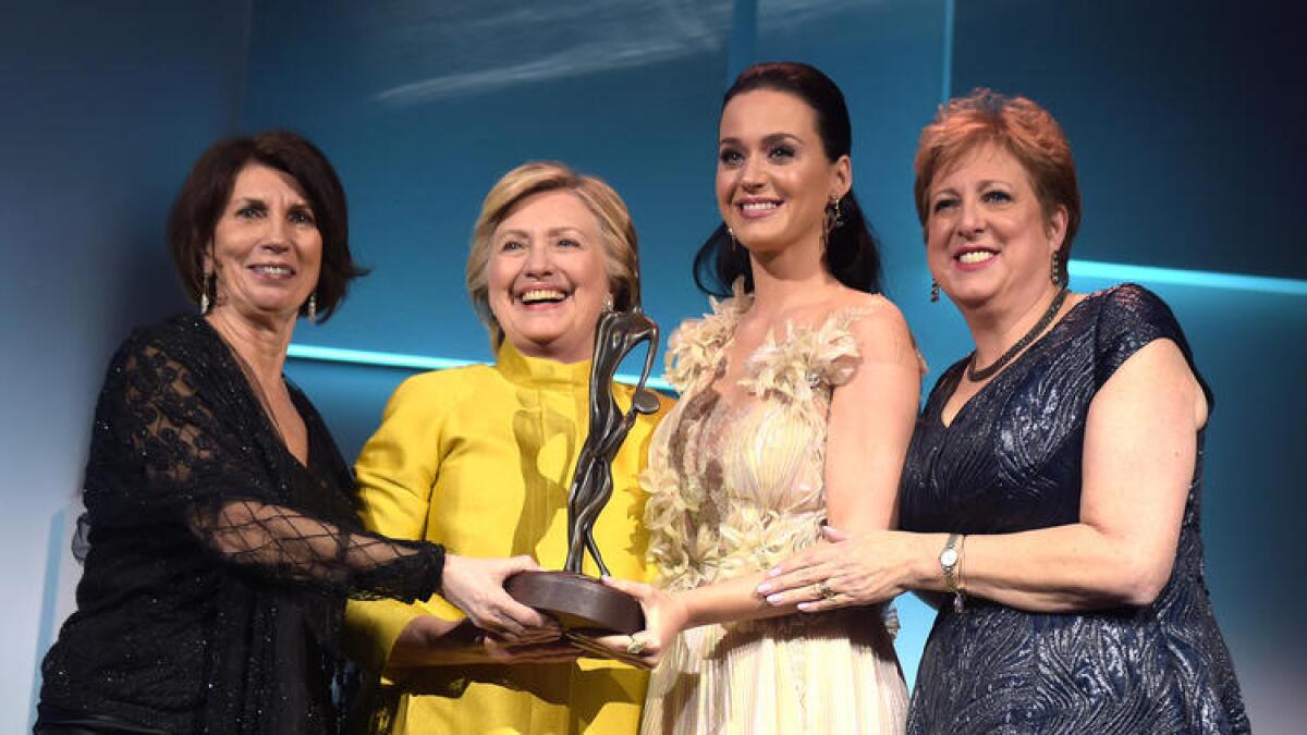 Hillary Clinton and Katy Perry with UNICEF's Pamela Fiori, left, and Caryl Stern, right.