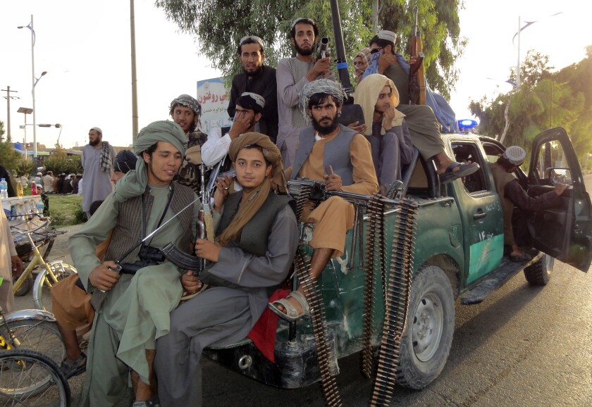Taliban fighters crowded into back of truck