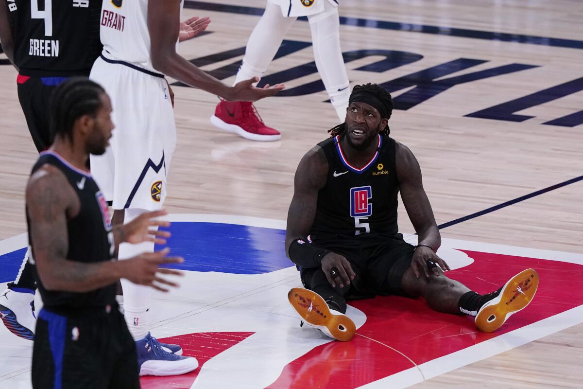 Montrezl Harrell sits on the court in the Clippers' semifinal playoff game against the Denver Nuggets.