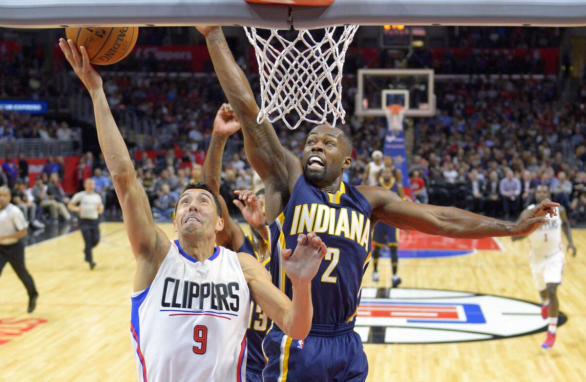 Clippers guard Pablo Prigioni (9) puts up a shot as Pacers guard Rodney Stuckey (2) tries to block it from behind during the first half.