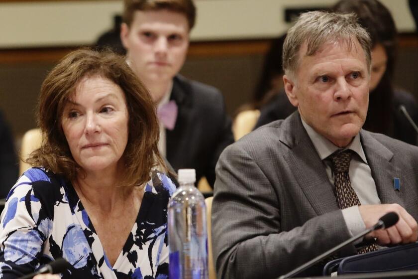FILE - In this May 3, 2018, file photo, Fred Warmbier, right, and Cindy Warmbier, parents of Otto Warmbier, wait for a meeting at the United Nations headquarters. A federal judge has ordered North Korea to pay more than $500 million in a wrongful death suit filed by the parents of Otto Warmbier, an American college student who died shortly after being released from that country. (AP Photo/Frank Franklin II, File)