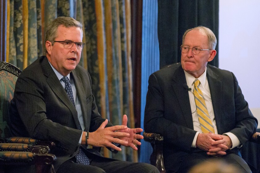 Former Florida Gov. Jeb Bush, left, seen here at a recent education forum, will headline a gathering in Las Vegas of possible GOP presidential hopefuls.