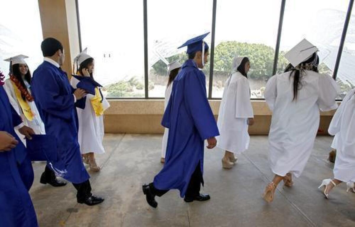 Graduates prep for the commencement ceremony in downtown Los Angeles.
