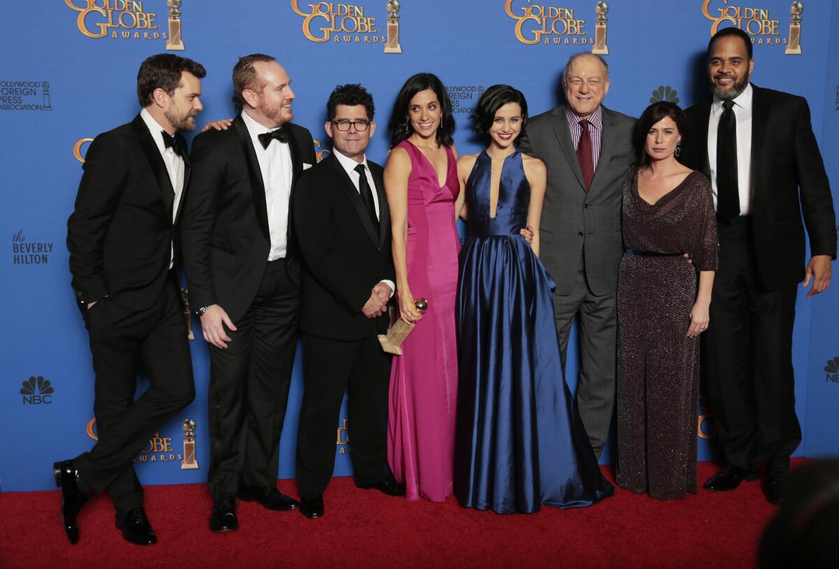 Sarah Treem and the cast of "The Affair" pose with their award for drama series at the 72nd Golden Globe Awards.