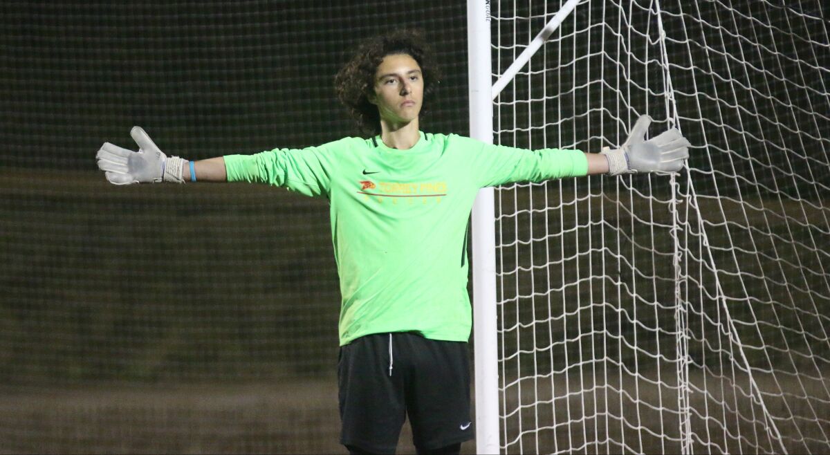 Keeper Nick Bello following one of his three penalty kick saves.