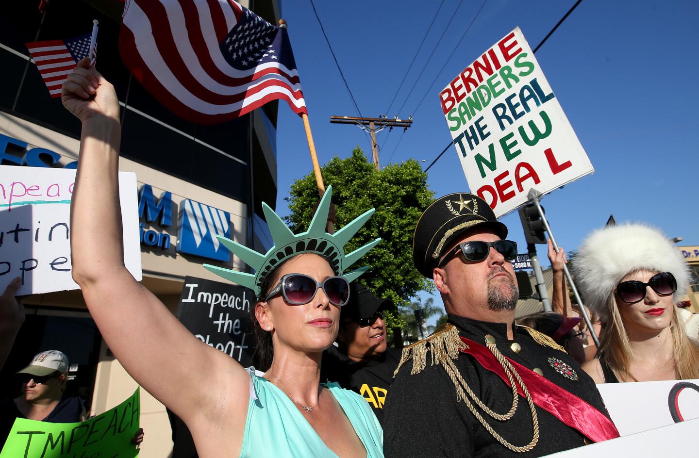 Anti-Trump protesters rally outside the district office of Rep. Brad Sherman in Van Nuys . A Democrat, Sherman has filed articles of impeachment against President Donald J. Trump.