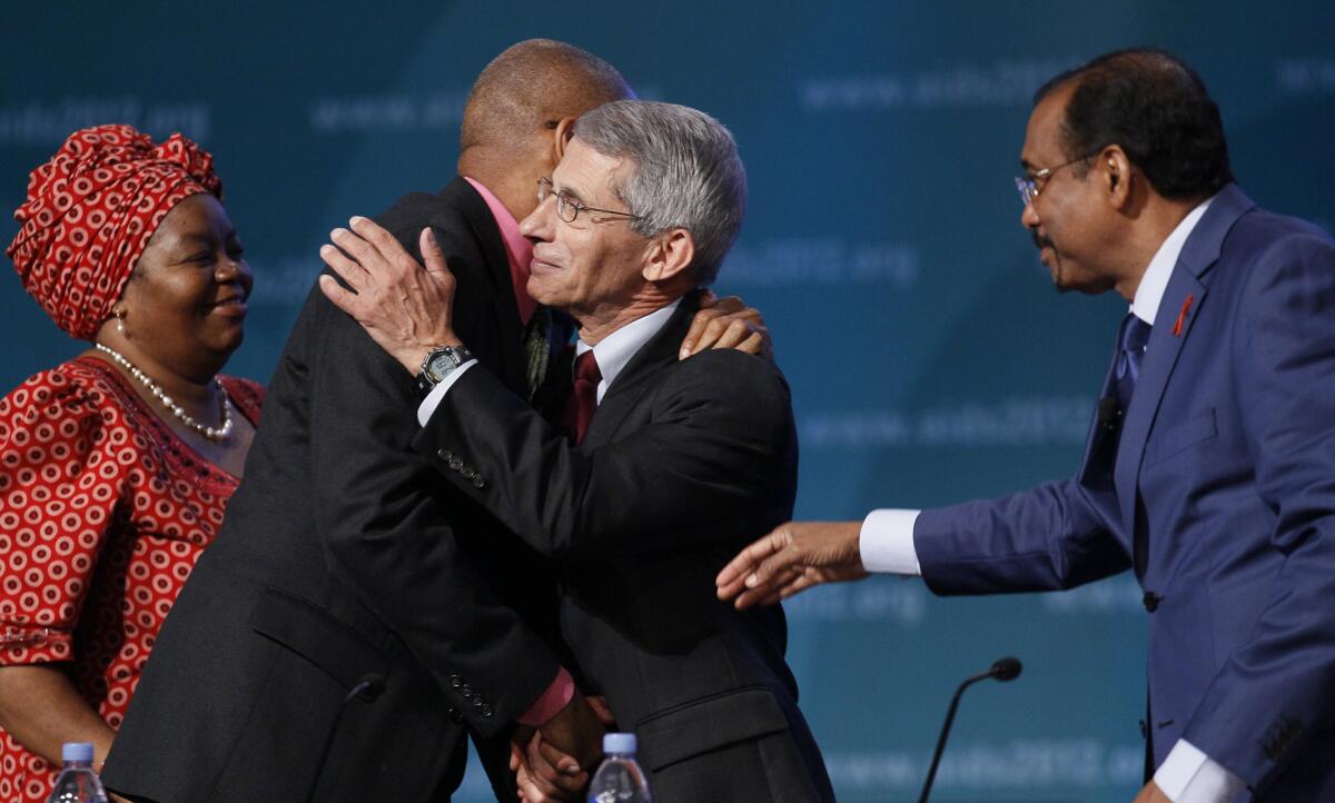 Sheila Tlou, Phill Wilson, Anthony Fauci, and UNAIDS Executive Director Michel Sidibe, gather on stage 