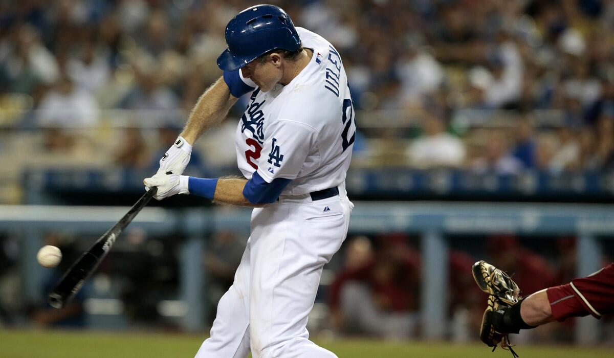 Dodgers second baseman Chase Utley connects for an RBI double against the Arizona Diamondbacks at Dodger Stadium on Sept. 23.