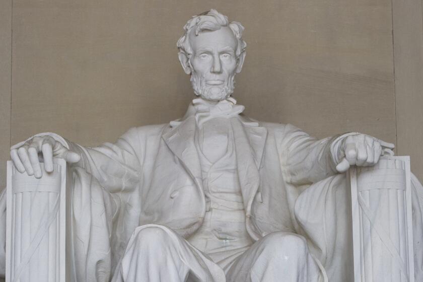 The words of Lincoln's second inaugural address are inscribed on a wall near the statue of the president at the Lincoln Memorial in Washington, D.C.