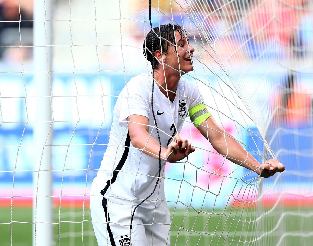 U.S. forward Abby Wambach reacts after missing a shot against South Korea in her team's final tuneup for the World Cup.