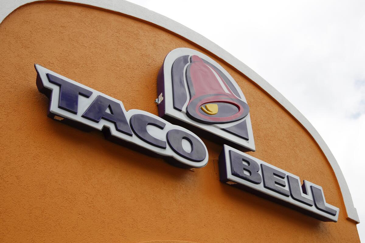 A sign hangs at a Taco Bell in Mount Lebanon, Pa. 