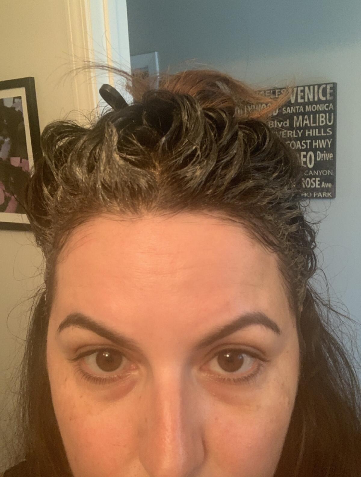 Jennifer Ianni colors her hair at home.