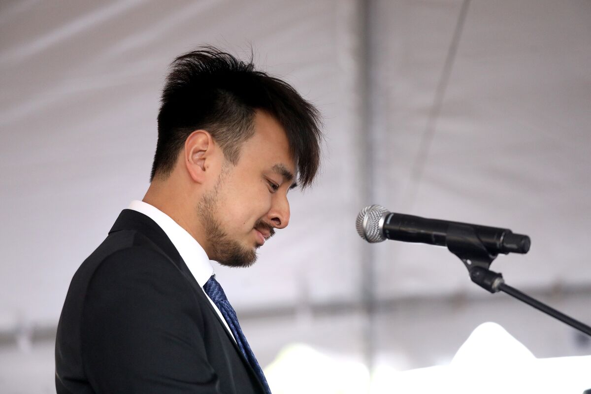 Brandon Tsay speaks to the crows after being awarded a medal of courage from the Alhambra Police Department.