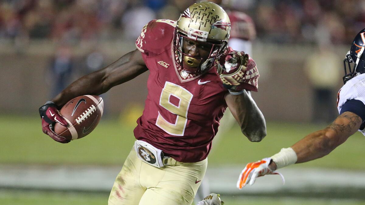 Florida State's Karlos Williams carries the ball during a 34-20 win over Virginia on Saturday.